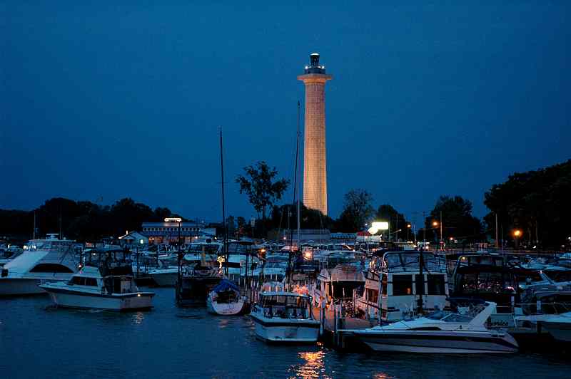 Night view of the monument across the harbor